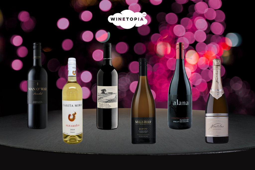 Wine bottles displayed on a table with a blurred bokeh background featuring the 'Winetopia' brand.